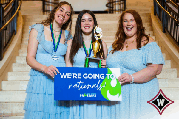 Wando High School Wando High School’s first-place winners smiling and holding their trophy.